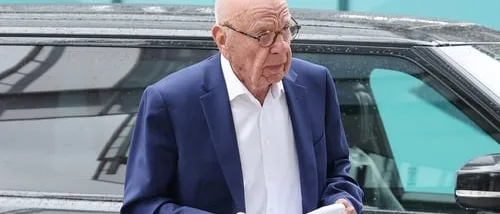Rupert Murdoch in a dark suit arriving at a courthouse during his family trust legal battle