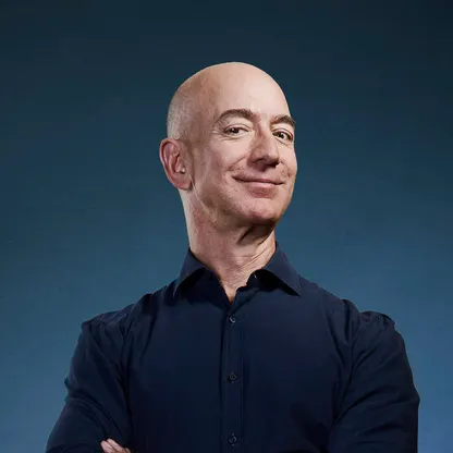 Jeff Bezos in a dark suit at a formal event